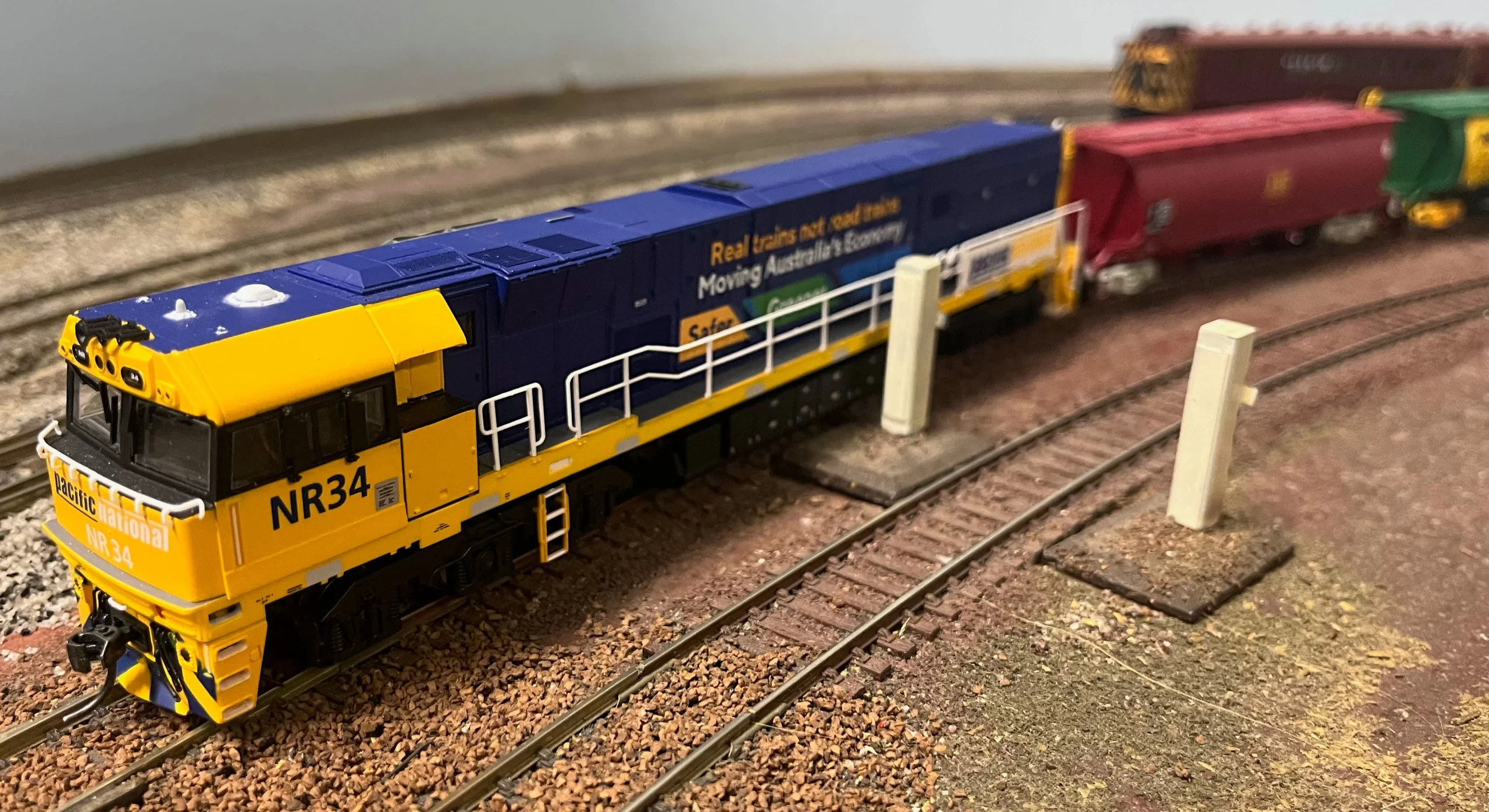 NR34 hauls a rake of grain bogie wagons to the Wharf for export.