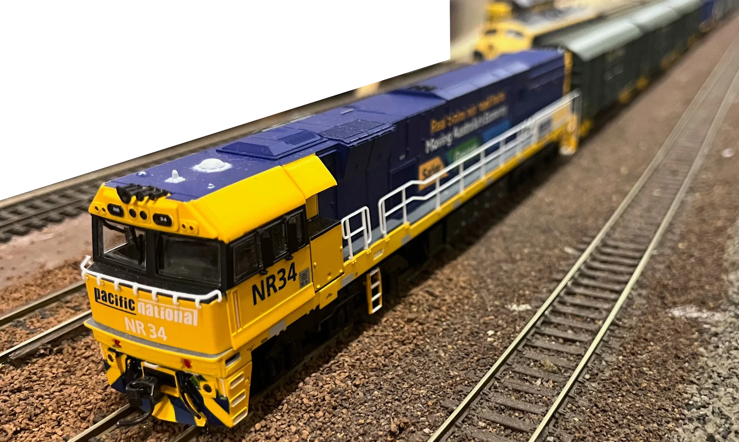 Pacific National NR34 pulling a mixed goods set.